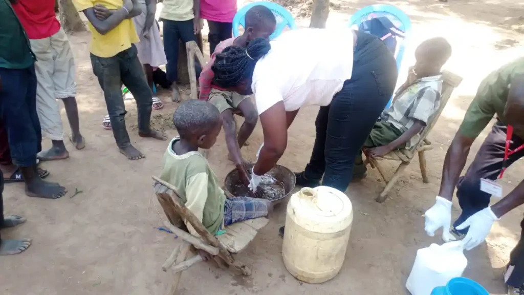 Community members in Bungoma participating in an anti-jigger campaign facilitated by DestinyImpact CBO to promote hygiene and prevent infestations