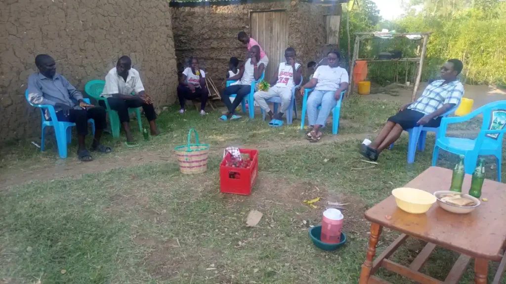 DestinyImpact CBO with a beneficiary in Bungoma celebrating the completion of O-level studies as part of its education support programs.