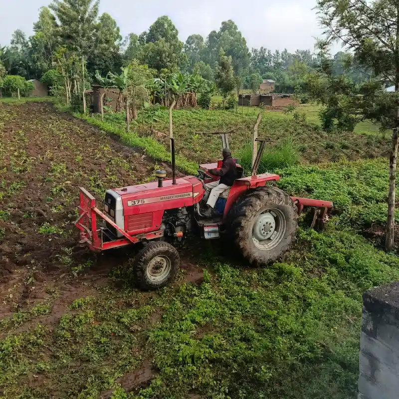 A tractor preparing farmland in Bungoma as part of DestinyImpact CBO’s livelihood support program to empower rural households