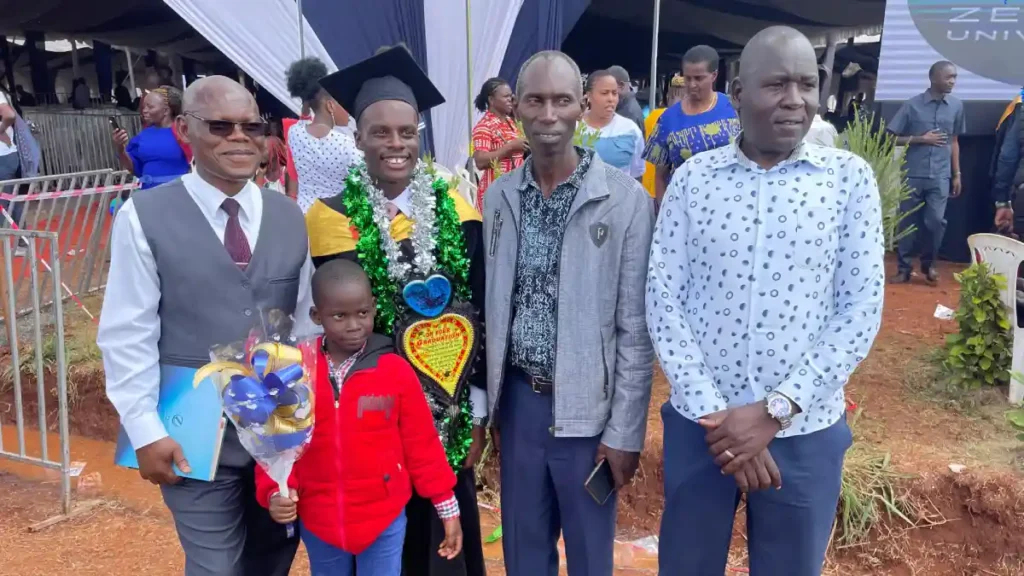 A DestinyImpact CBO representative with a beneficiary celebrating their graduation with a bachelor’s degree in Bungoma, Kenya.