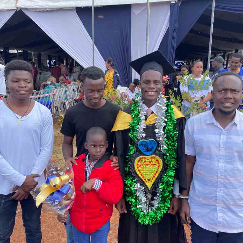 A DestinyImpact CBO representative with a beneficiary celebrating their graduation with a bachelor’s degree in Bungoma, Kenya.