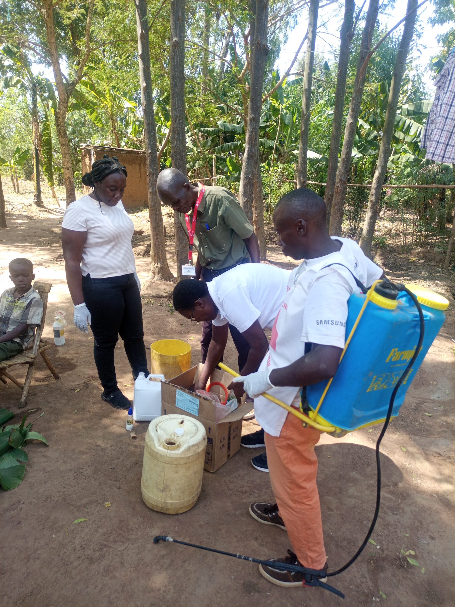 Destiny and Red Cross Bungoma volunteers preparing anti-jigger treatment