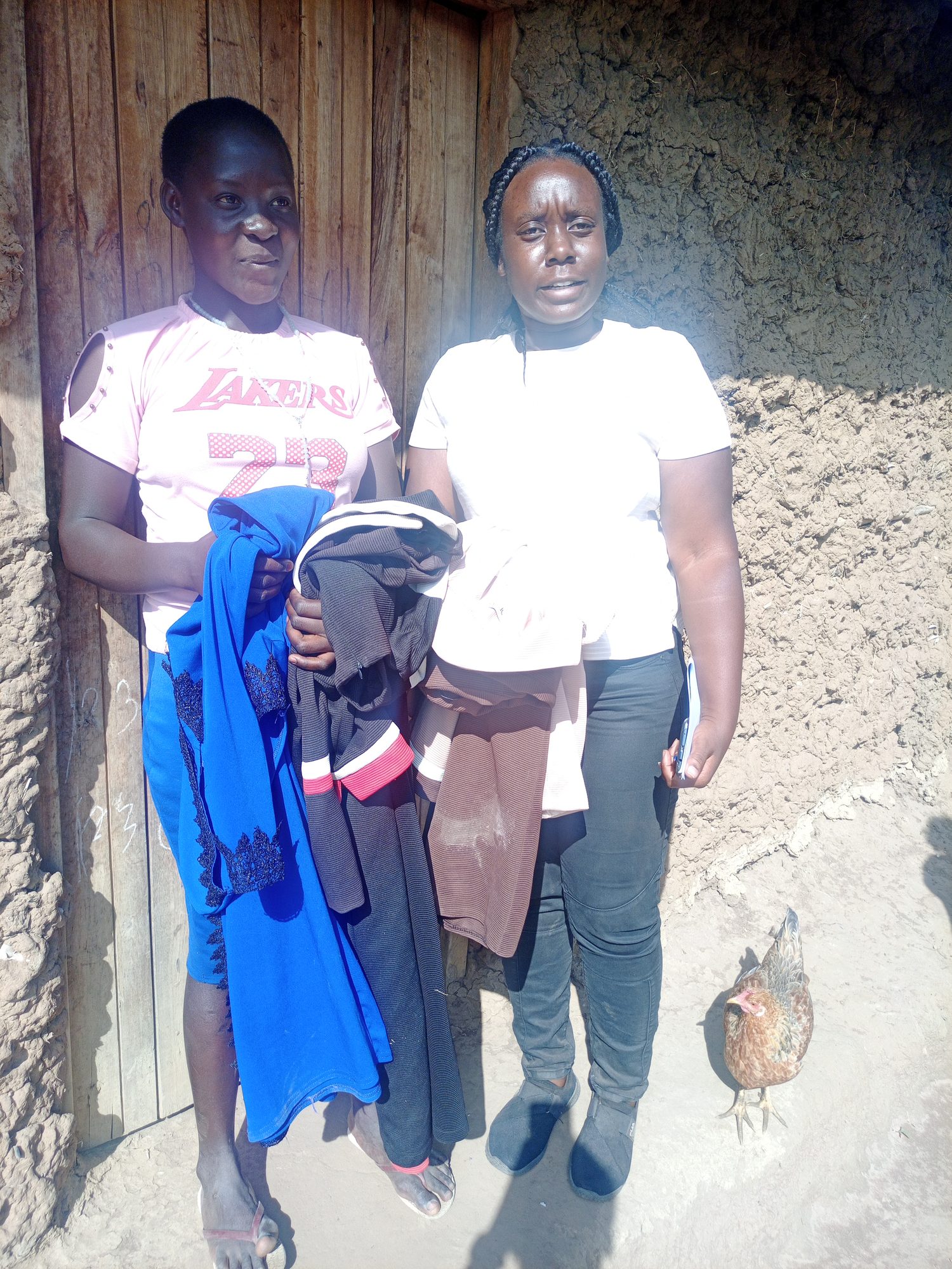 A girl receives clothes from a Destiny volunteer